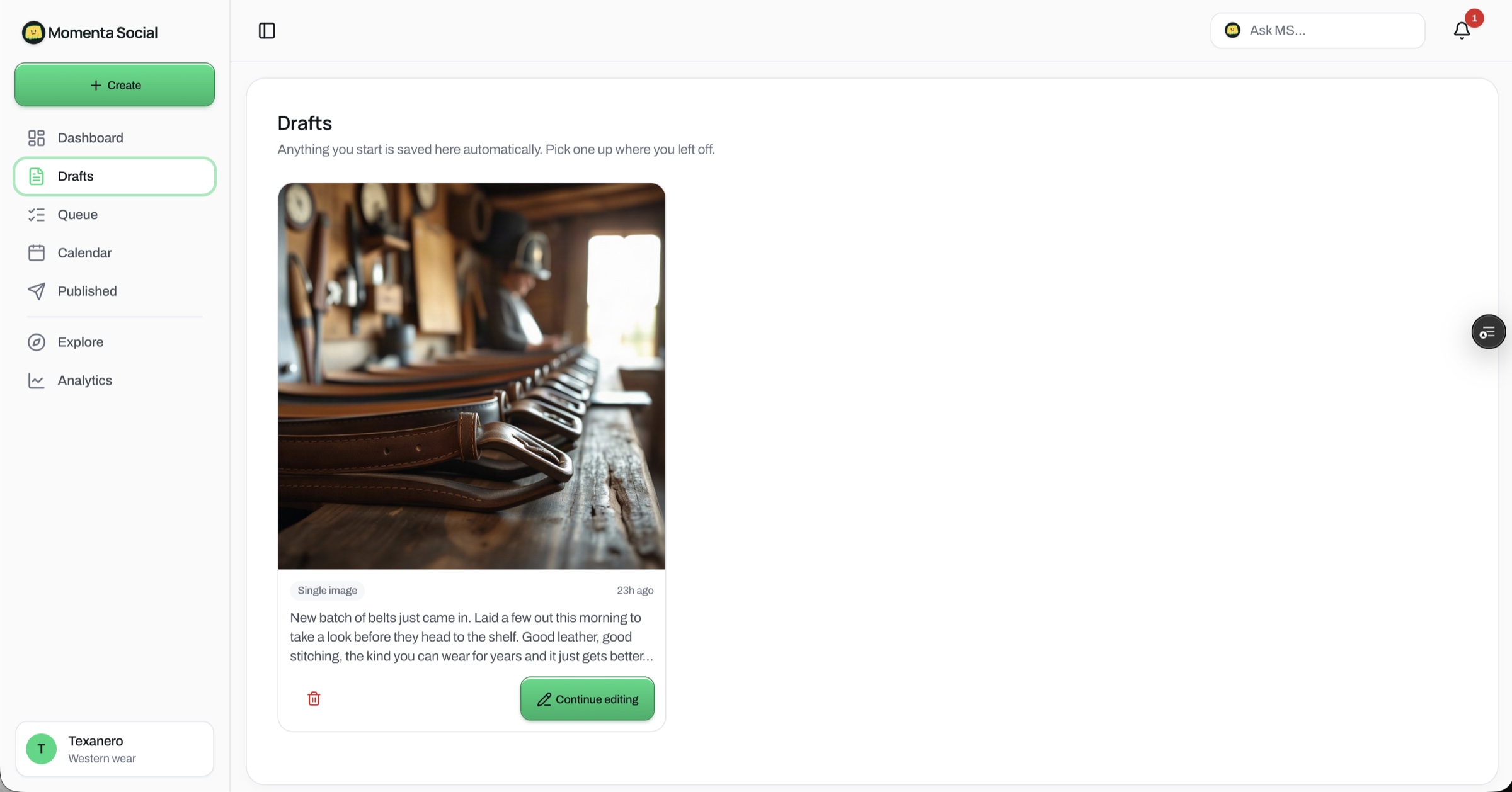 M Social drafts — a saved post pairs an AI-generated leather-goods image with on-brand copy in the tenant's voice